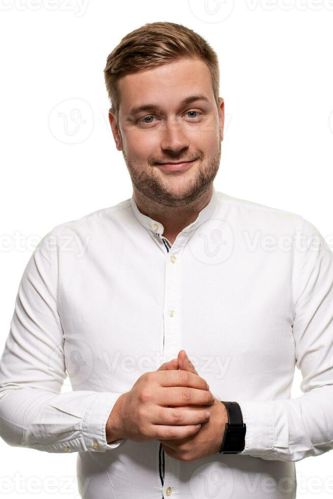 Close up horizontal portrait of a handsome man with a beard, stylish haircut, wearing a white shirt, isolated on a white background photo