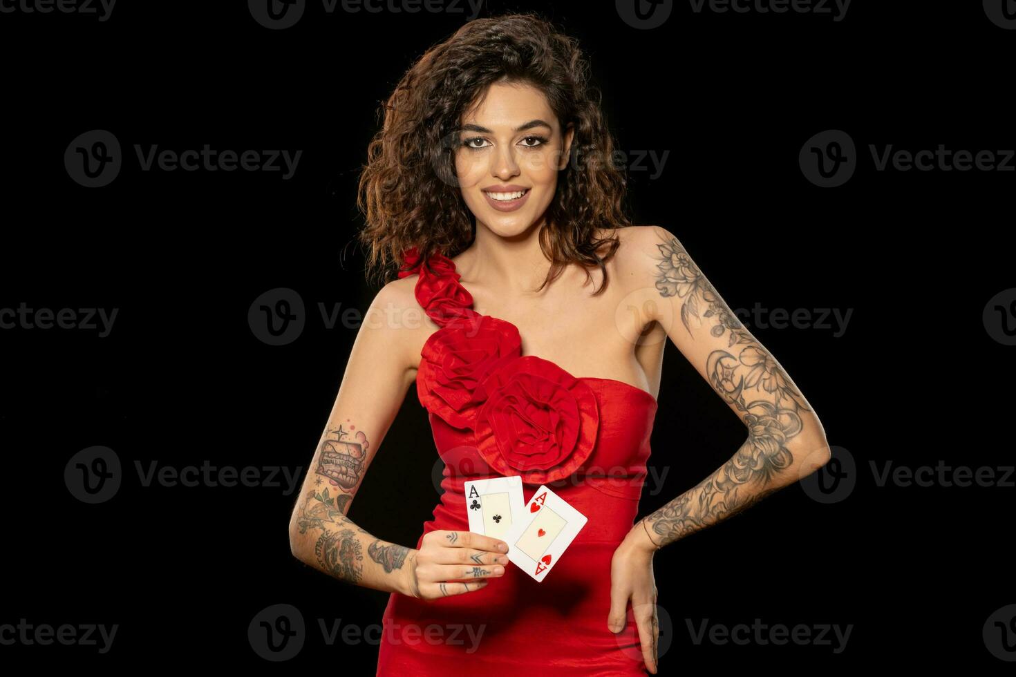 Gambling young woman showing winning combination of two aces photo