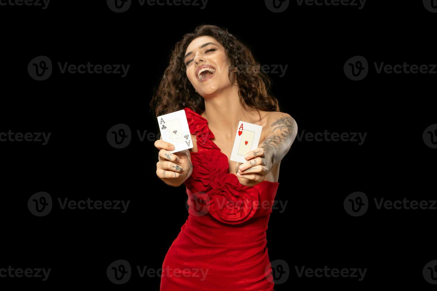 Lucky excited girl poker player showing winning pair of aces photo