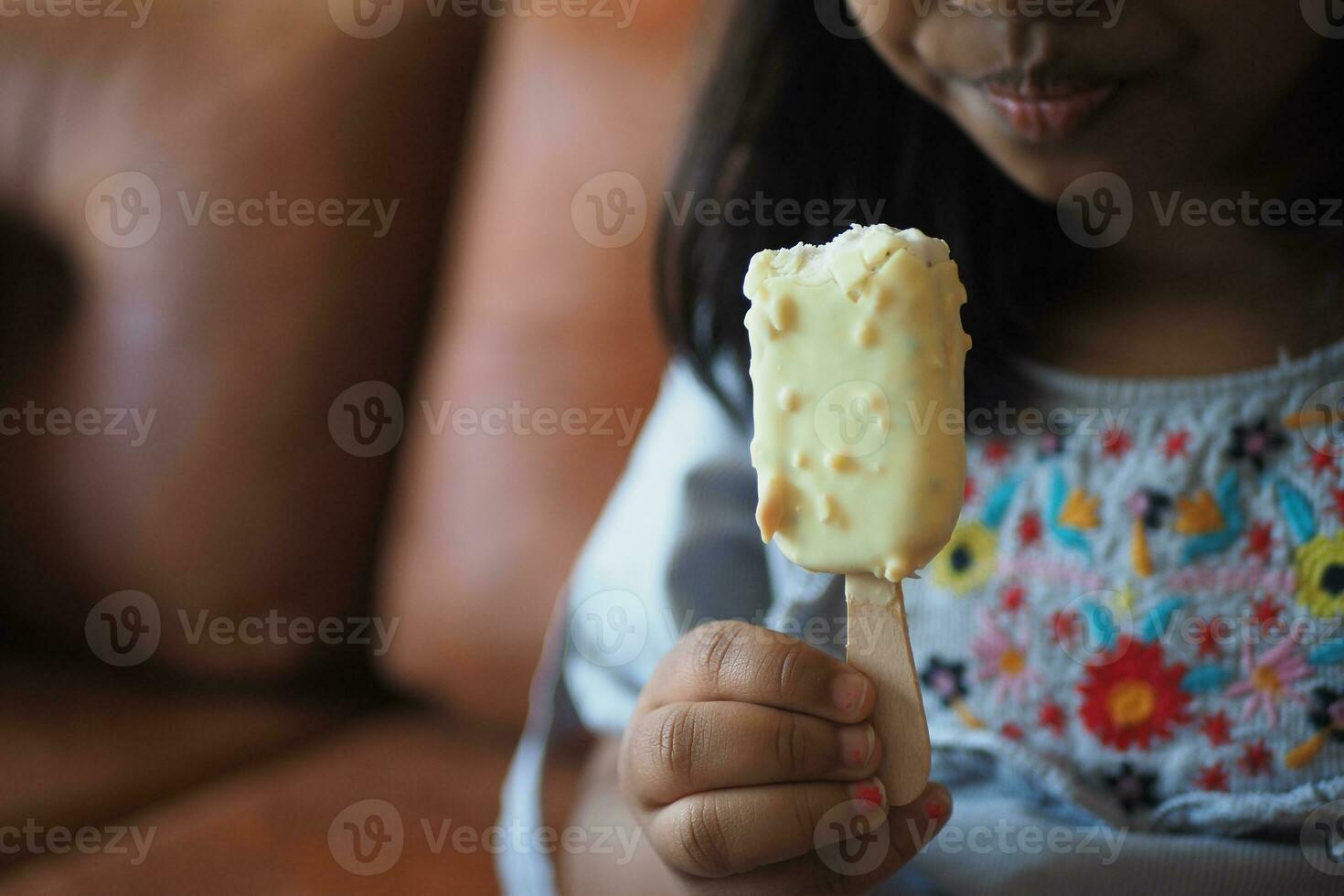 Child Hand Holding Ice Cream photo