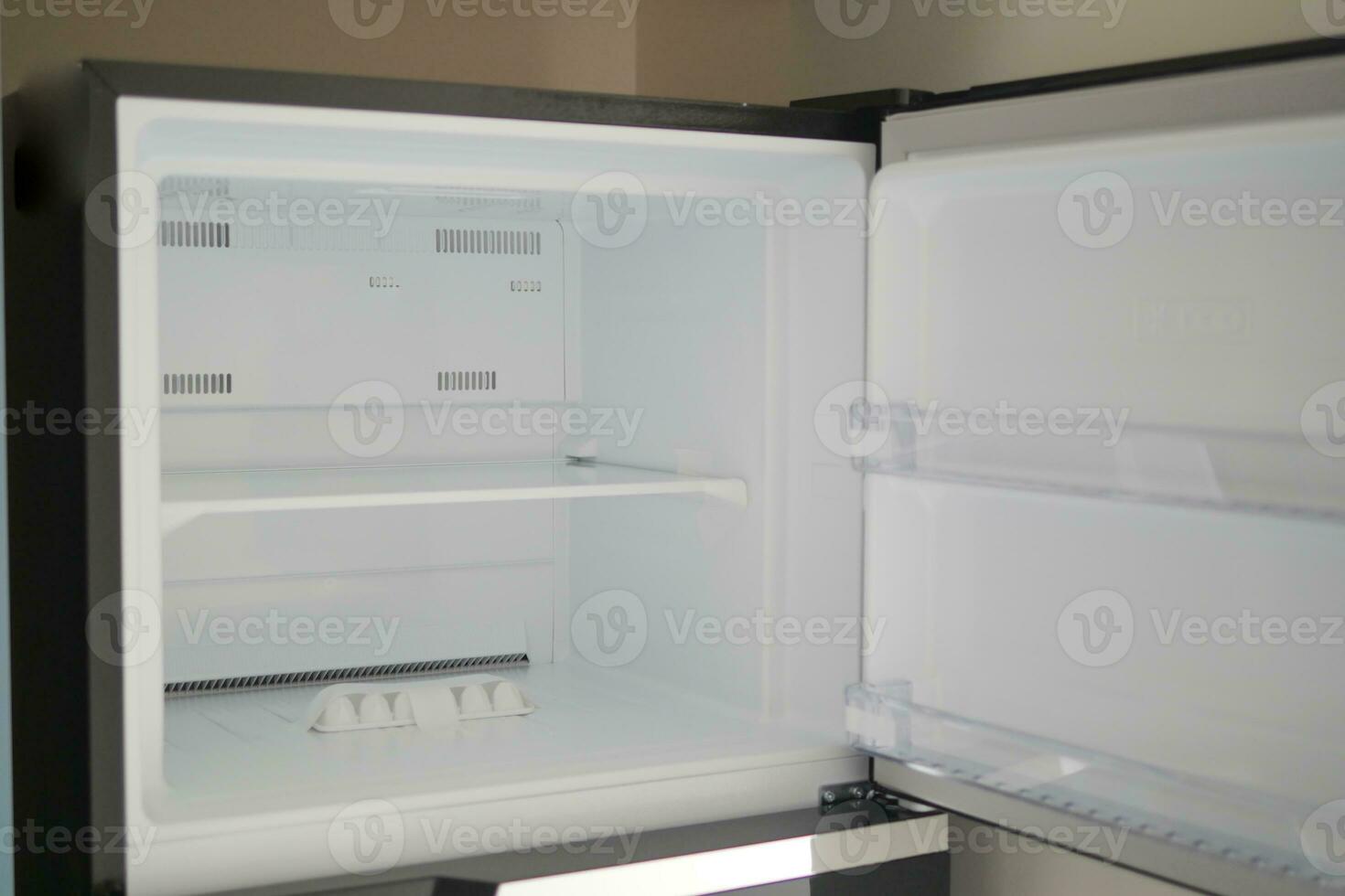 open empty fridge at home photo