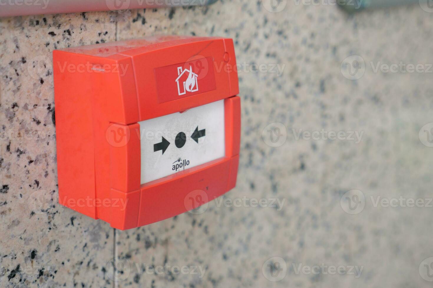 Red fire alarm button on wall , photo