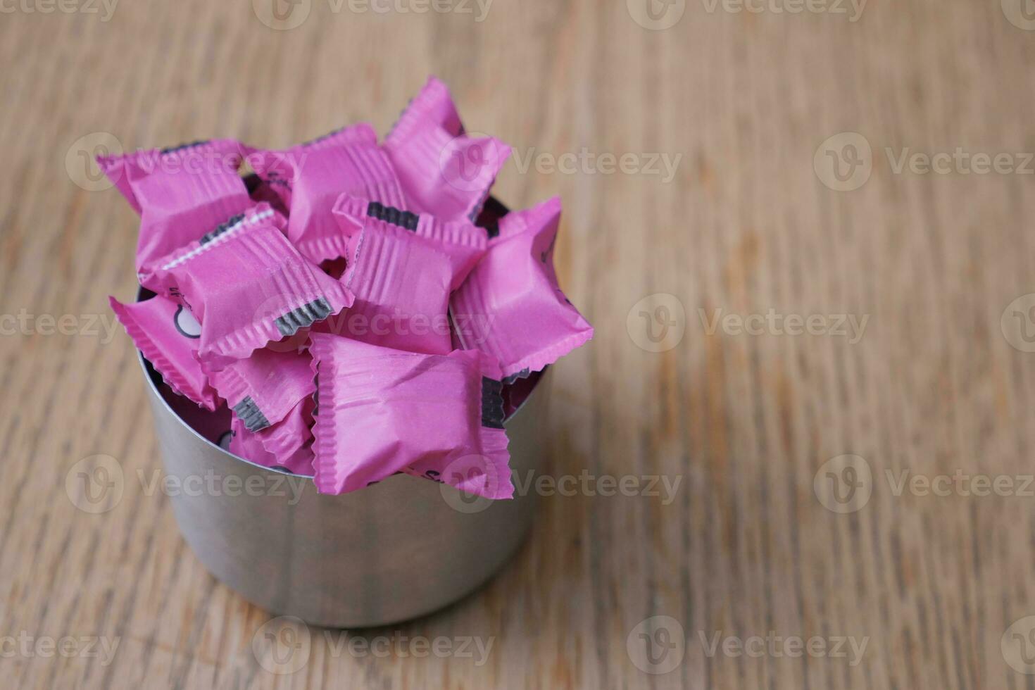 white sugar in a paper packet on table photo