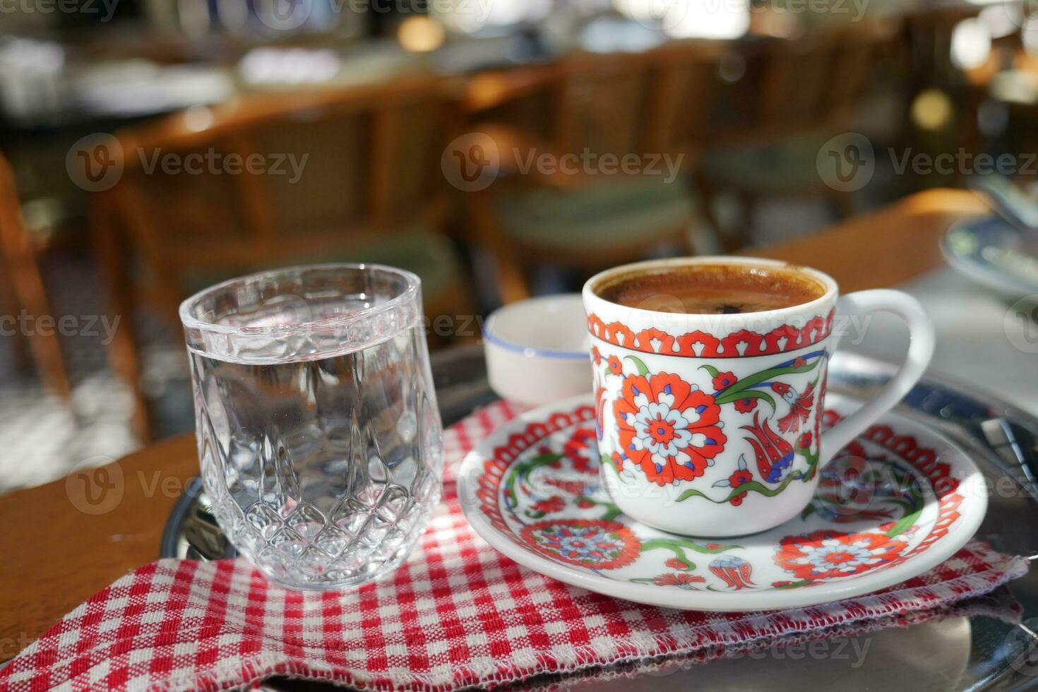 a cup of turkish coffee on table photo