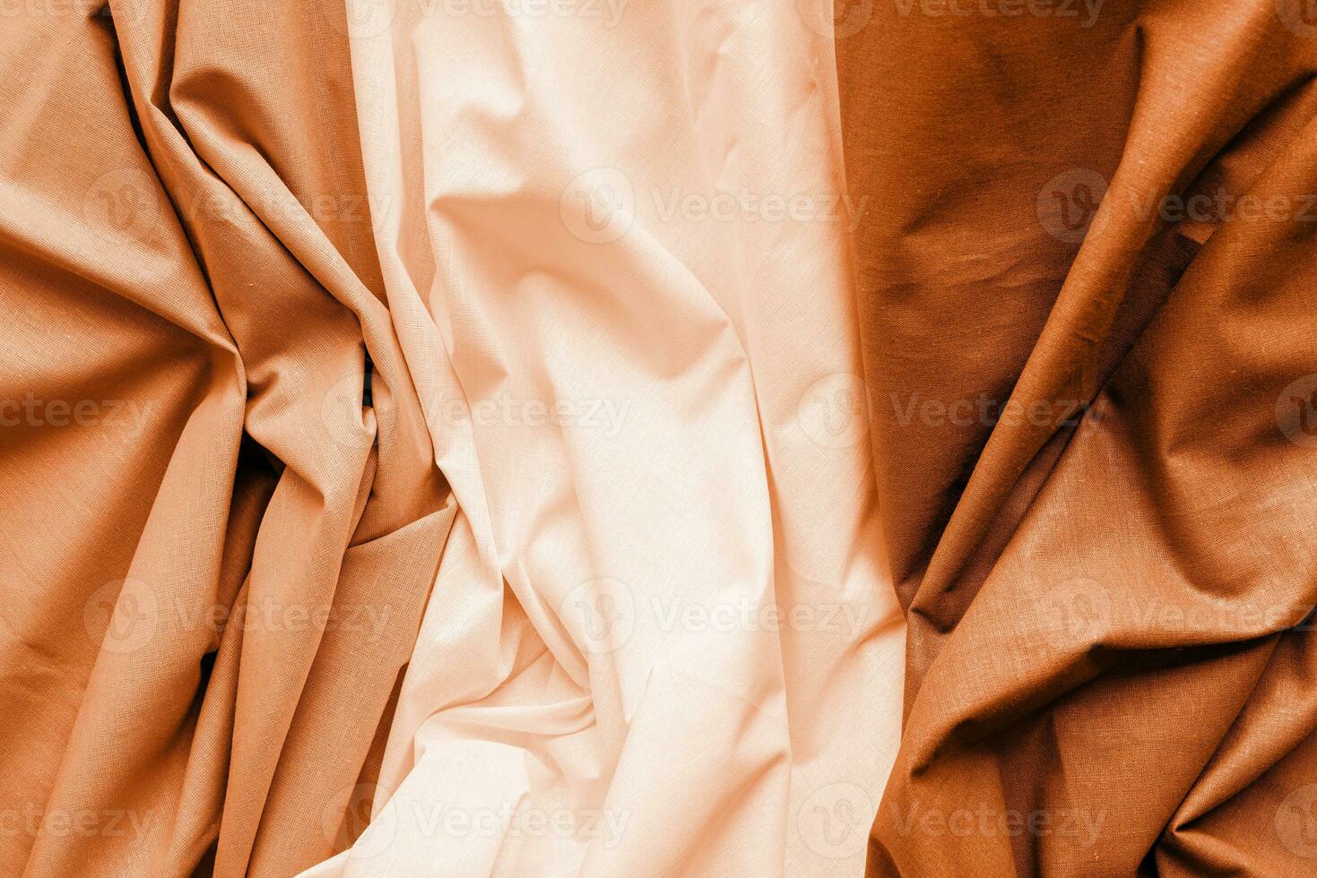 Color of the year 2024, Peach Fuzz. fabric texture background, three types of wavy fabric photo