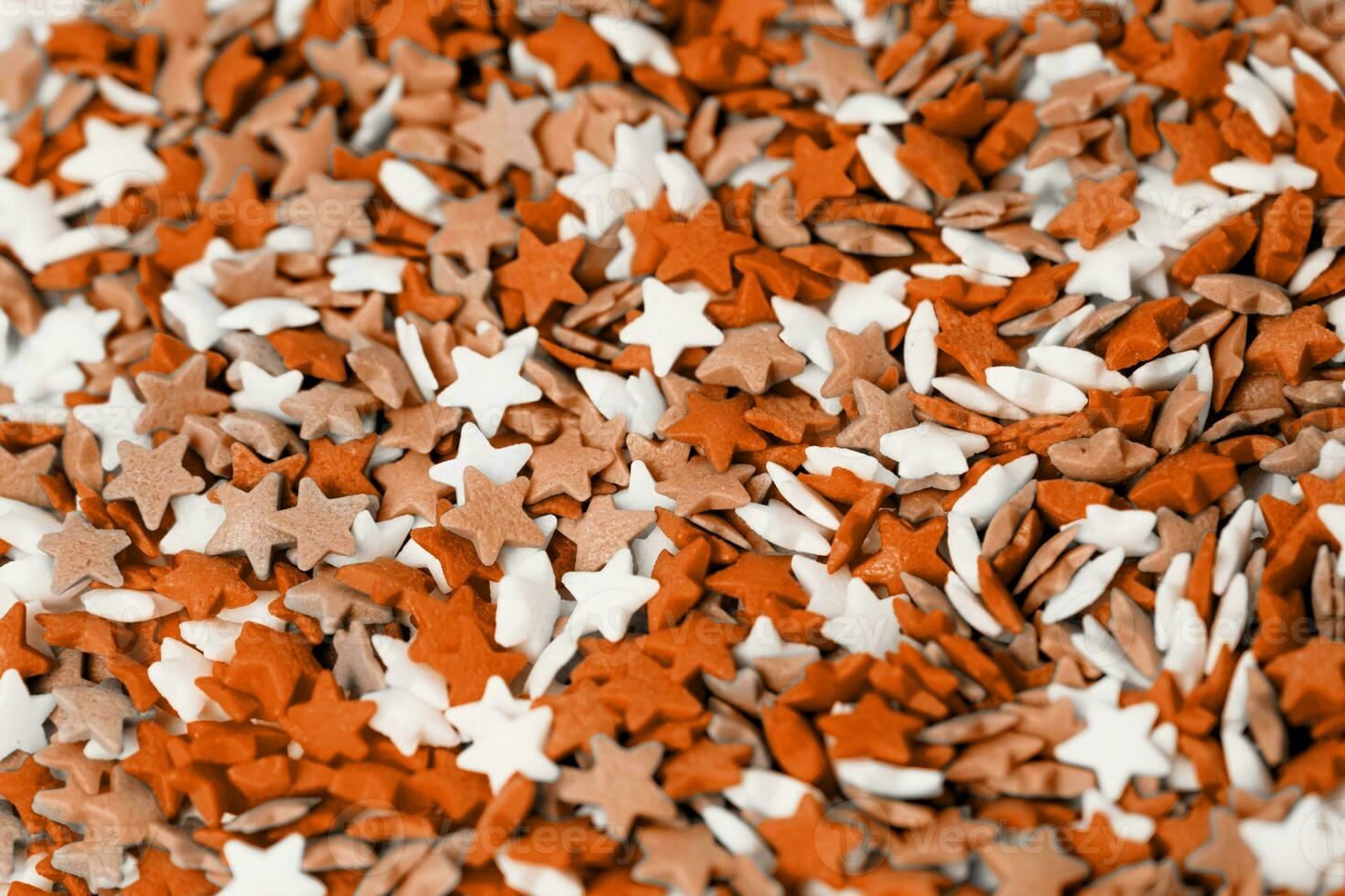 Color of the year 2024, Peach Fuzz. colorful star shape sprinkes decorations for fourth july texture photo