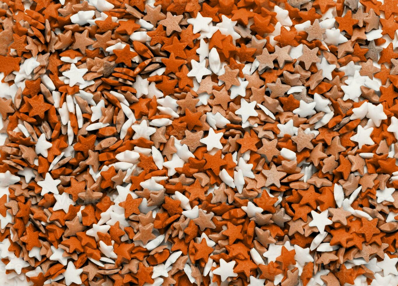 Color of the year 2024, Peach Fuzz. colorful star shape sprinkes decorations for fourth july texture photo
