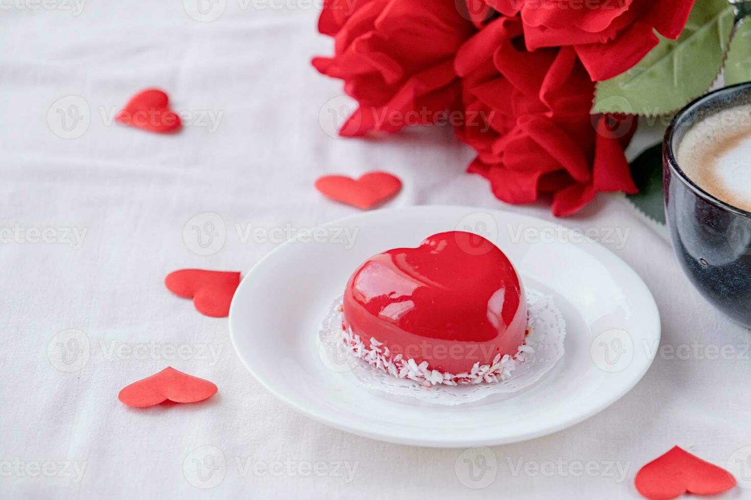 heart shaped glazed valentine cake in bed photo