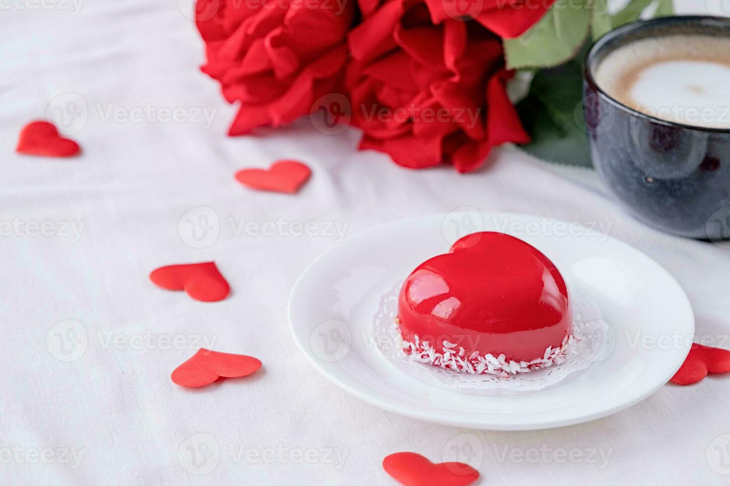 heart shaped glazed valentine cake in bed photo