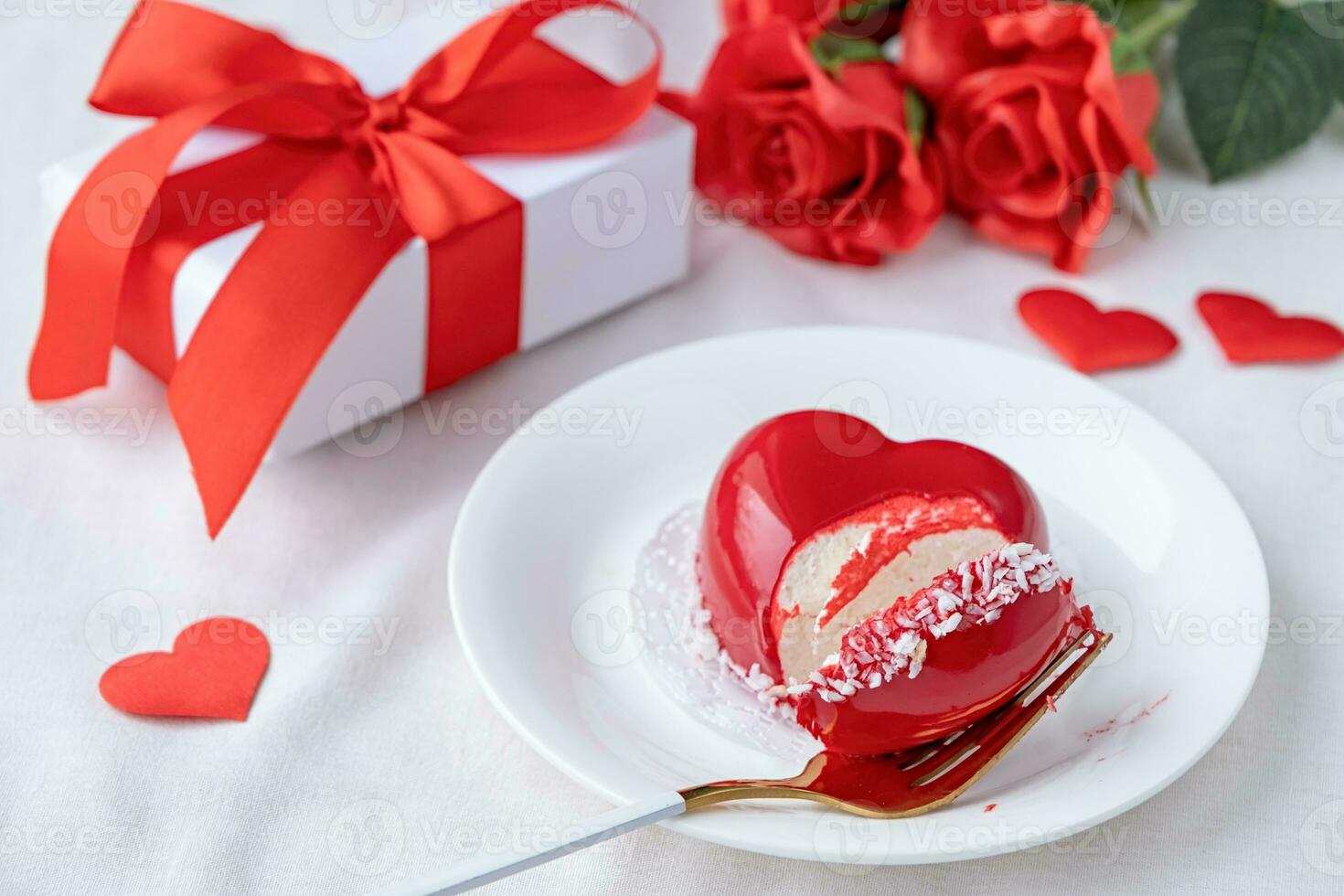 heart shaped glazed valentine cake in bed photo