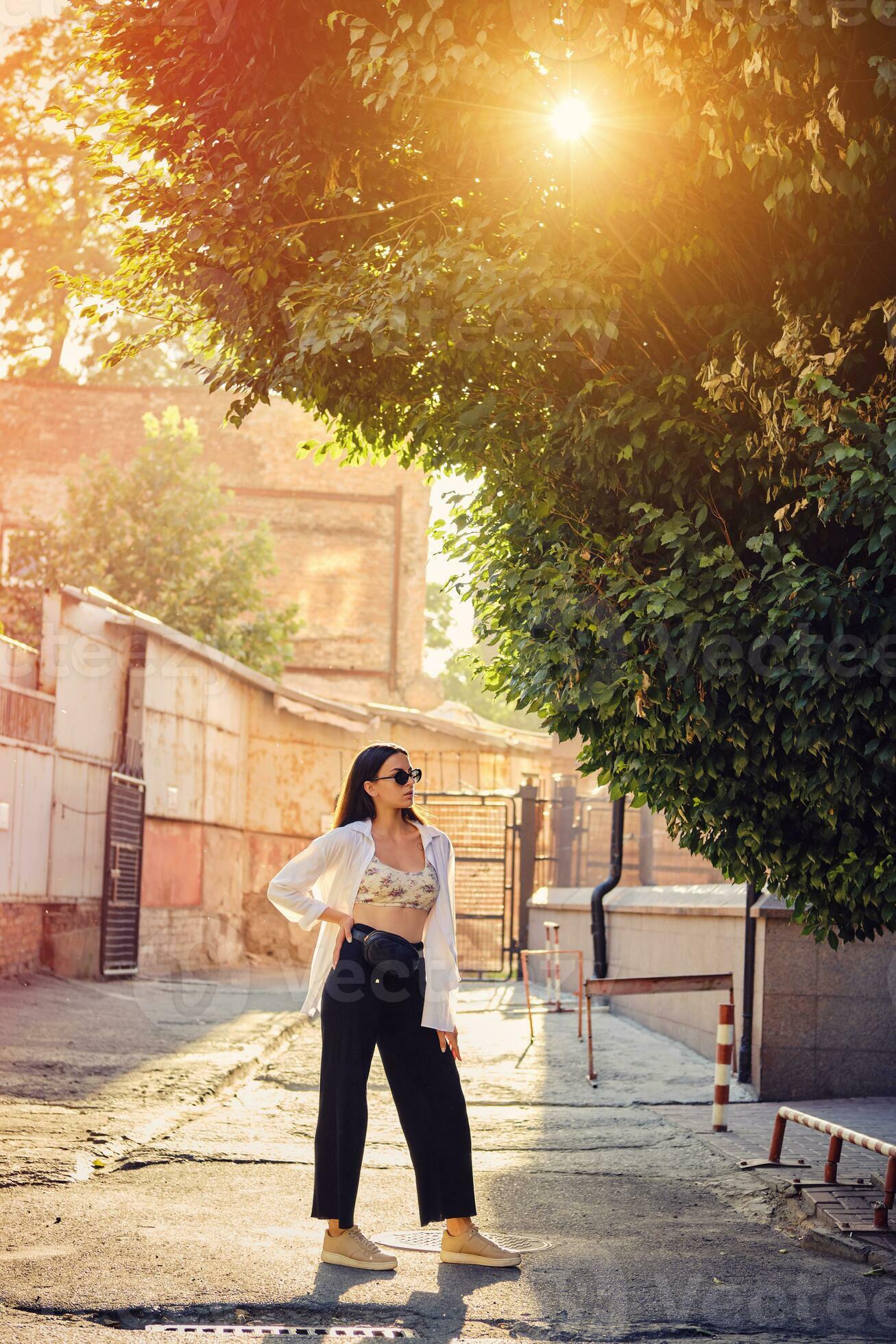 portrait-of-a-girl-in-dark-sunglasses-posing-in-city-dressed-in-top