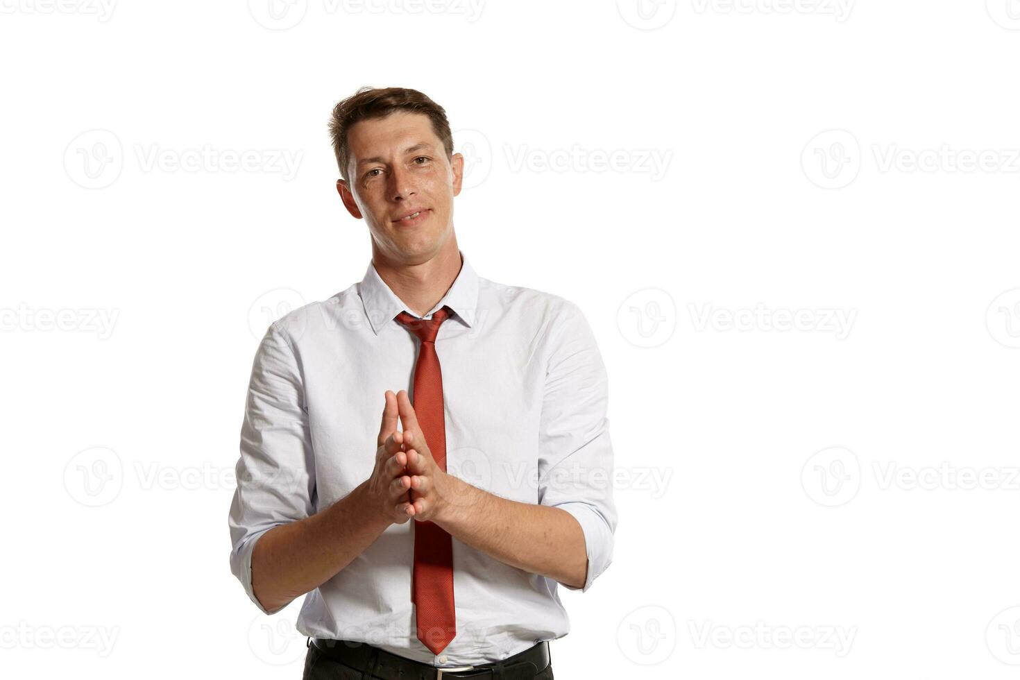 Portrait of a young brunet man posing in a studio isolated over a white background. photo