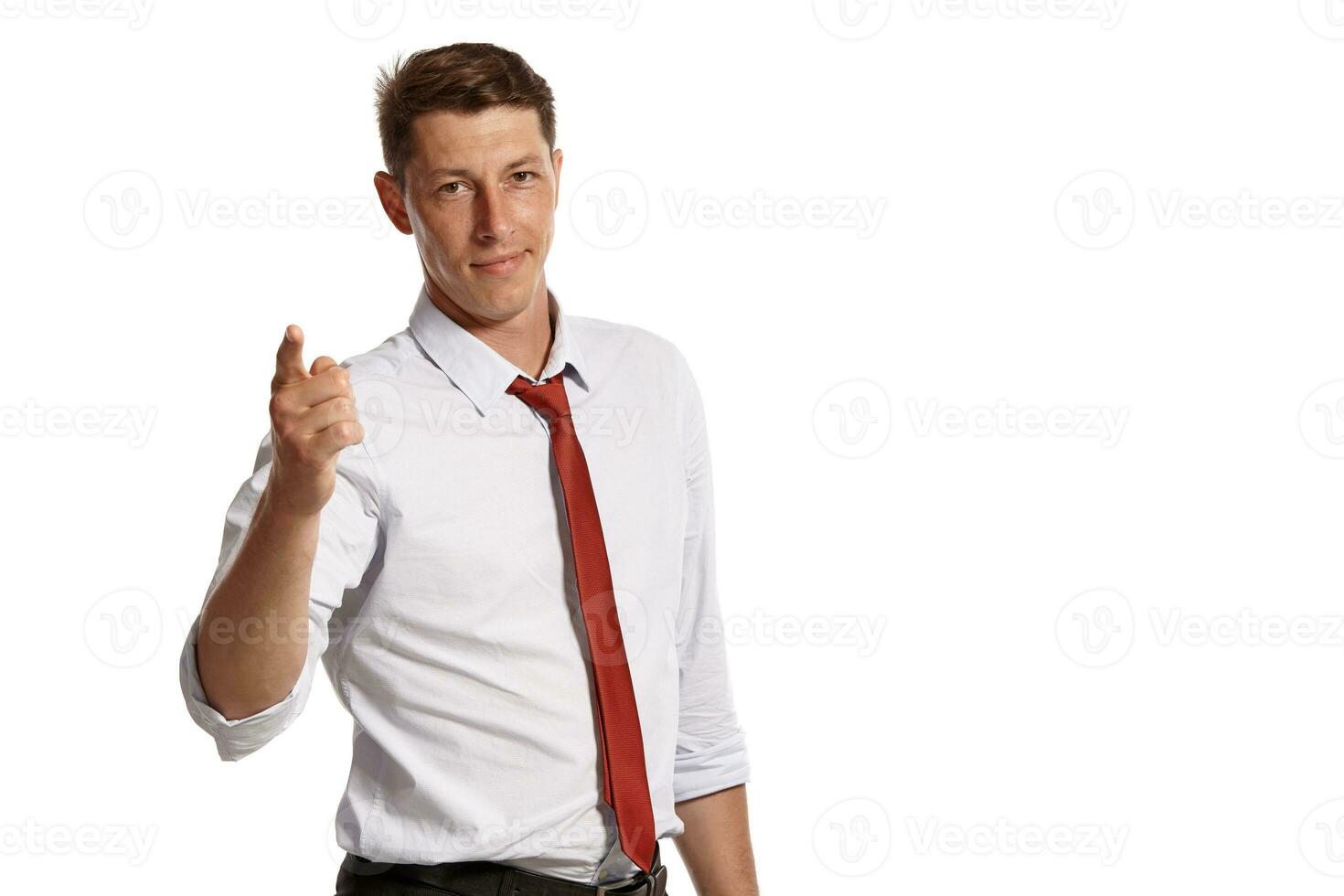 Portrait of a young brunet man posing in a studio isolated over a white background. photo