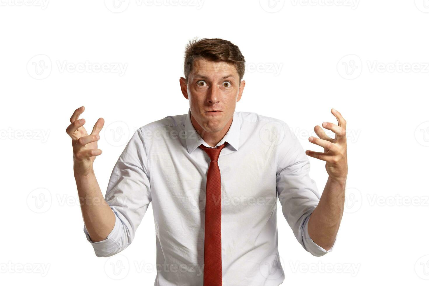 Portrait of a young brunet man posing in a studio isolated over a white background. photo