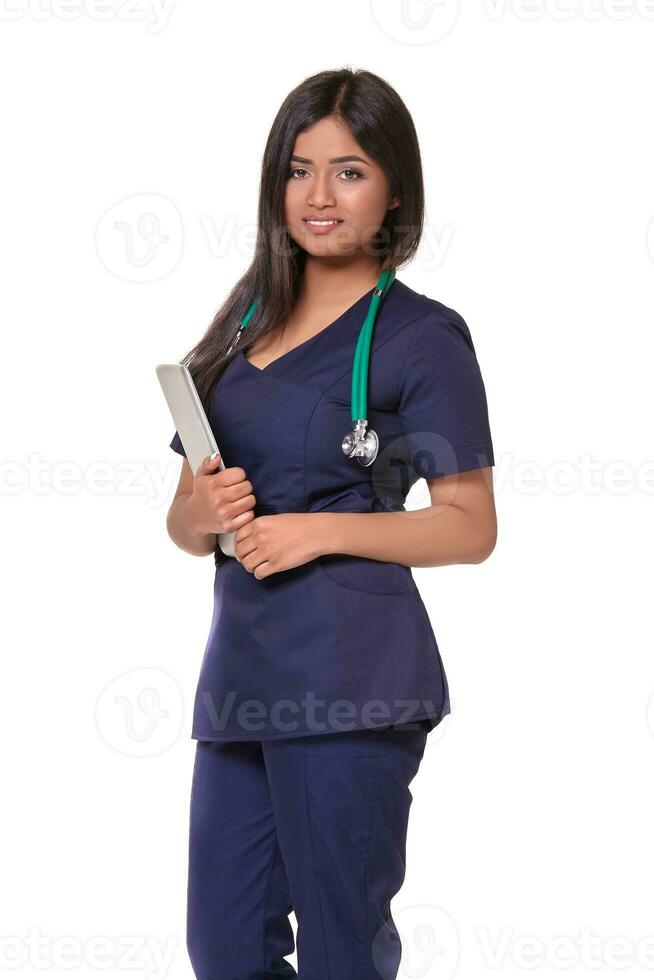 Young pretty doctor with a stethoscope and a medical history in her arms photo