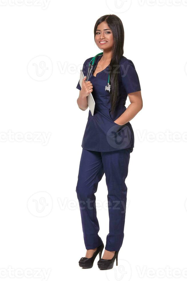 Portrait of young indian doctor woman with stethoscope around neck isolated on white background photo