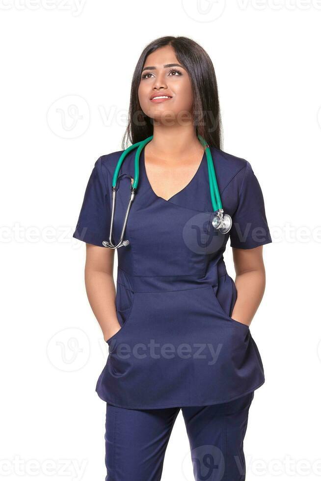 Portrait of young indian doctor woman with stethoscope around neck isolated on white background photo