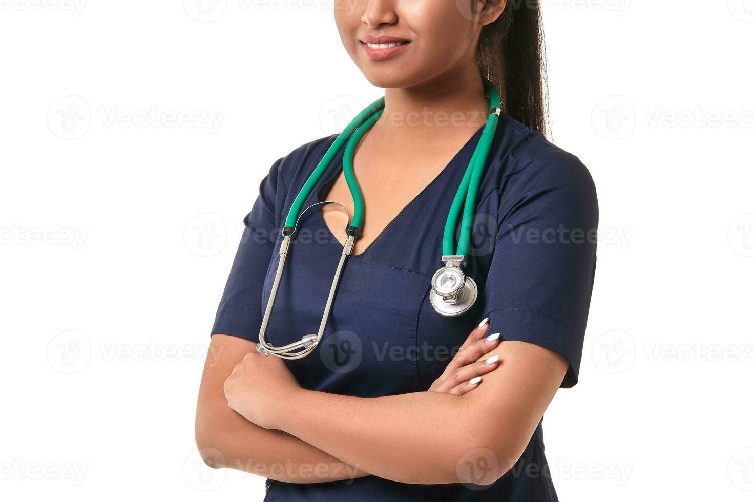 Beautiful young doctor with a stethoscope, isolated on white photo