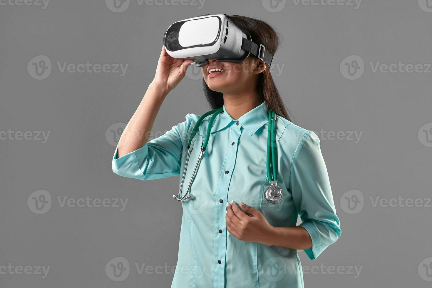 Young attractive doctor in a virtual reality glasses photo