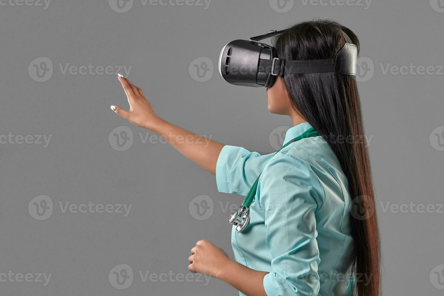 Young attractive doctor in a virtual reality glasses photo