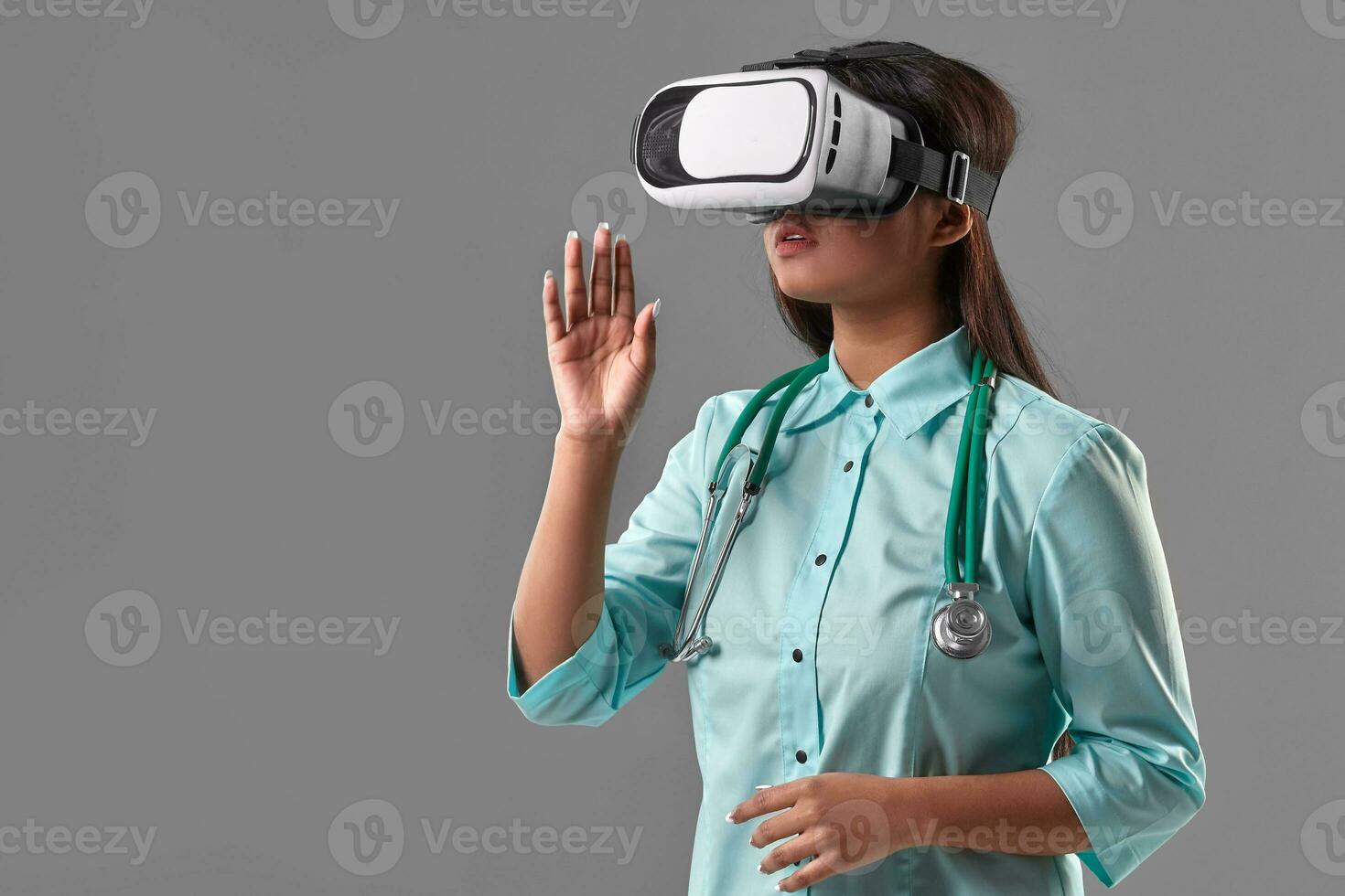 Young attractive doctor in a virtual reality glasses photo