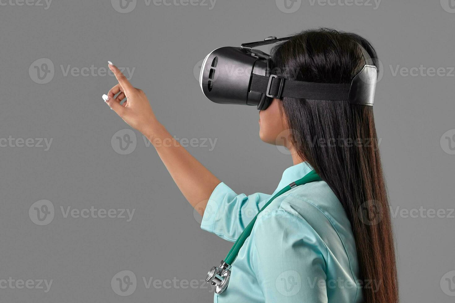 Young attractive doctor in a virtual reality glasses photo