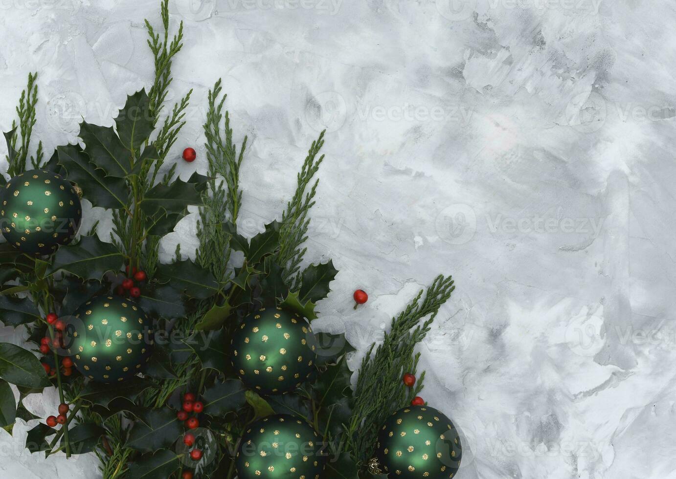 Christmas or new year table decor with fir branches, holly branches with berries photo