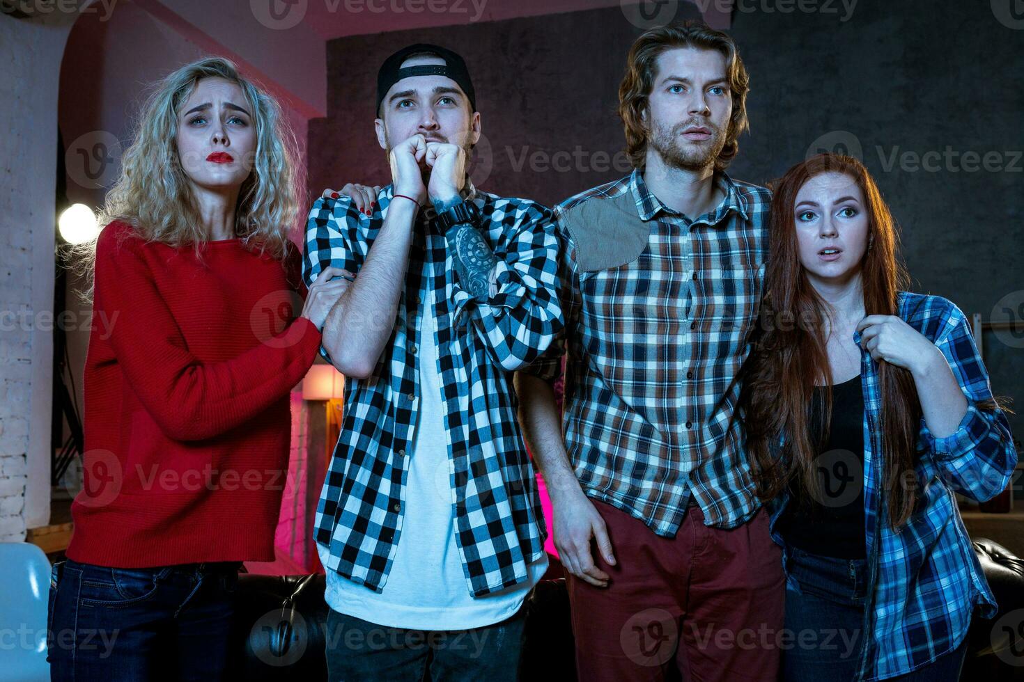 Group of friends watching TV match at home photo