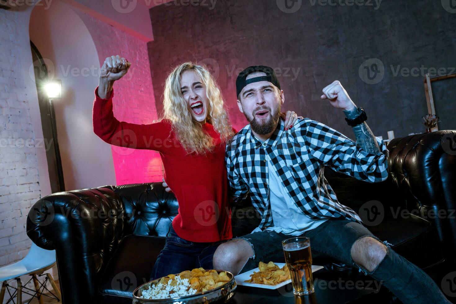 Friends are fans of sports games as football, basketball, hockey photo