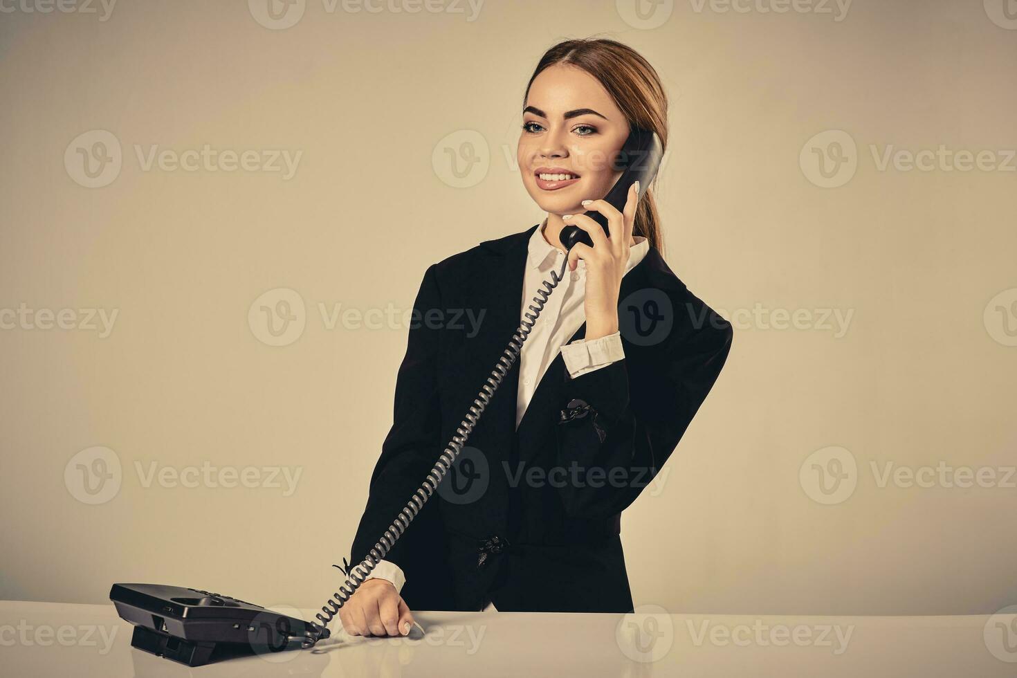 Portrait of young woman sitting at the table and working. photo