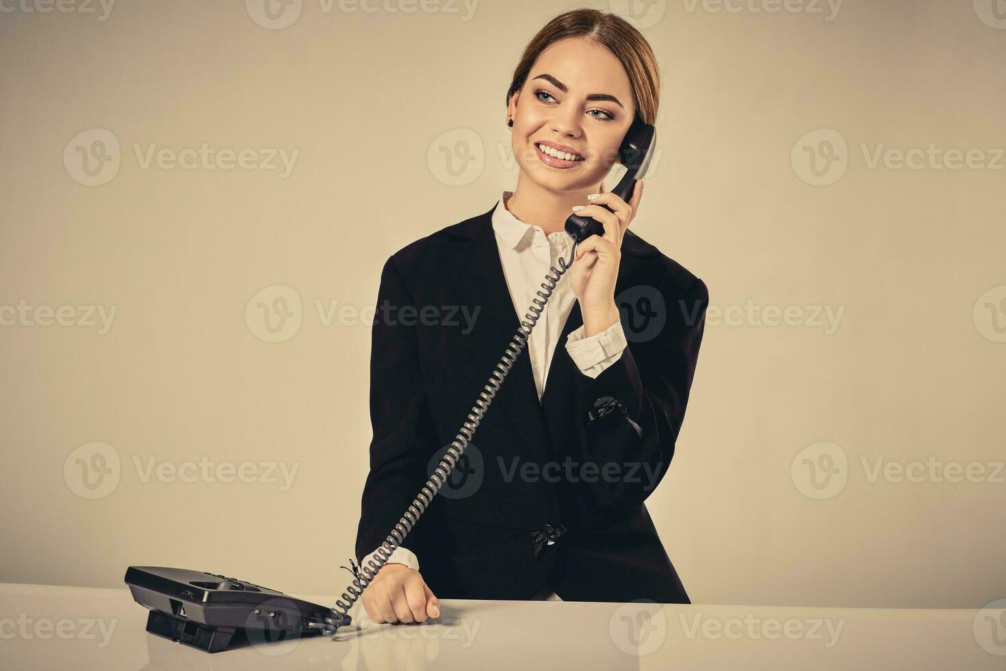 Portrait of young woman sitting at the table and working. photo