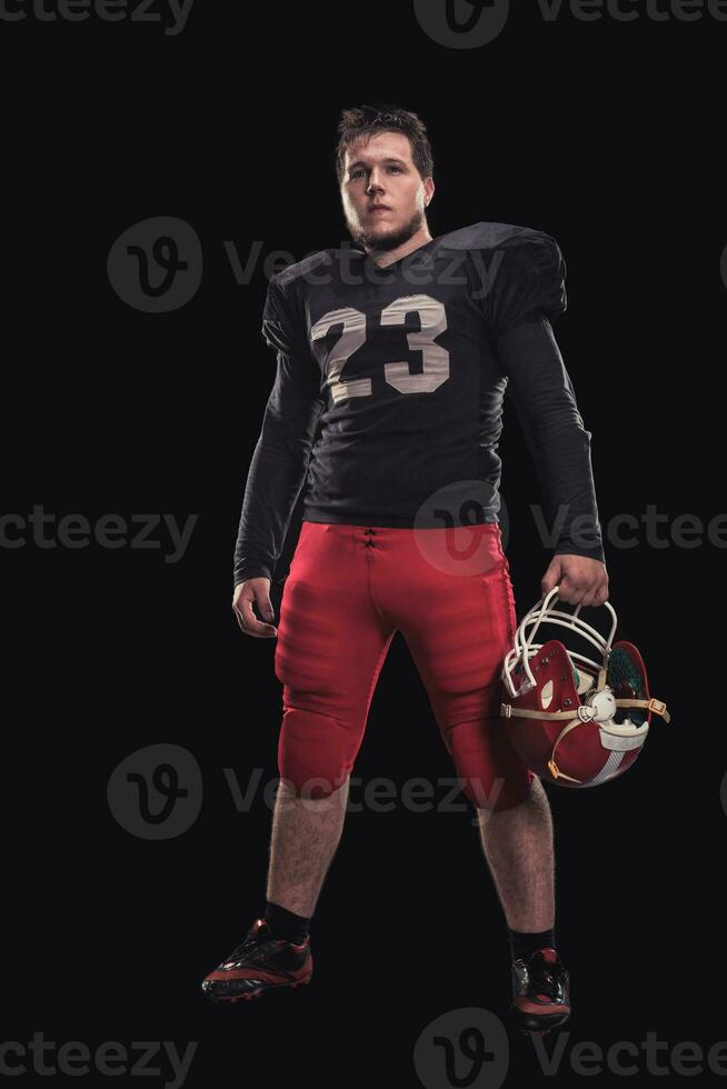 Football player on dark background photo