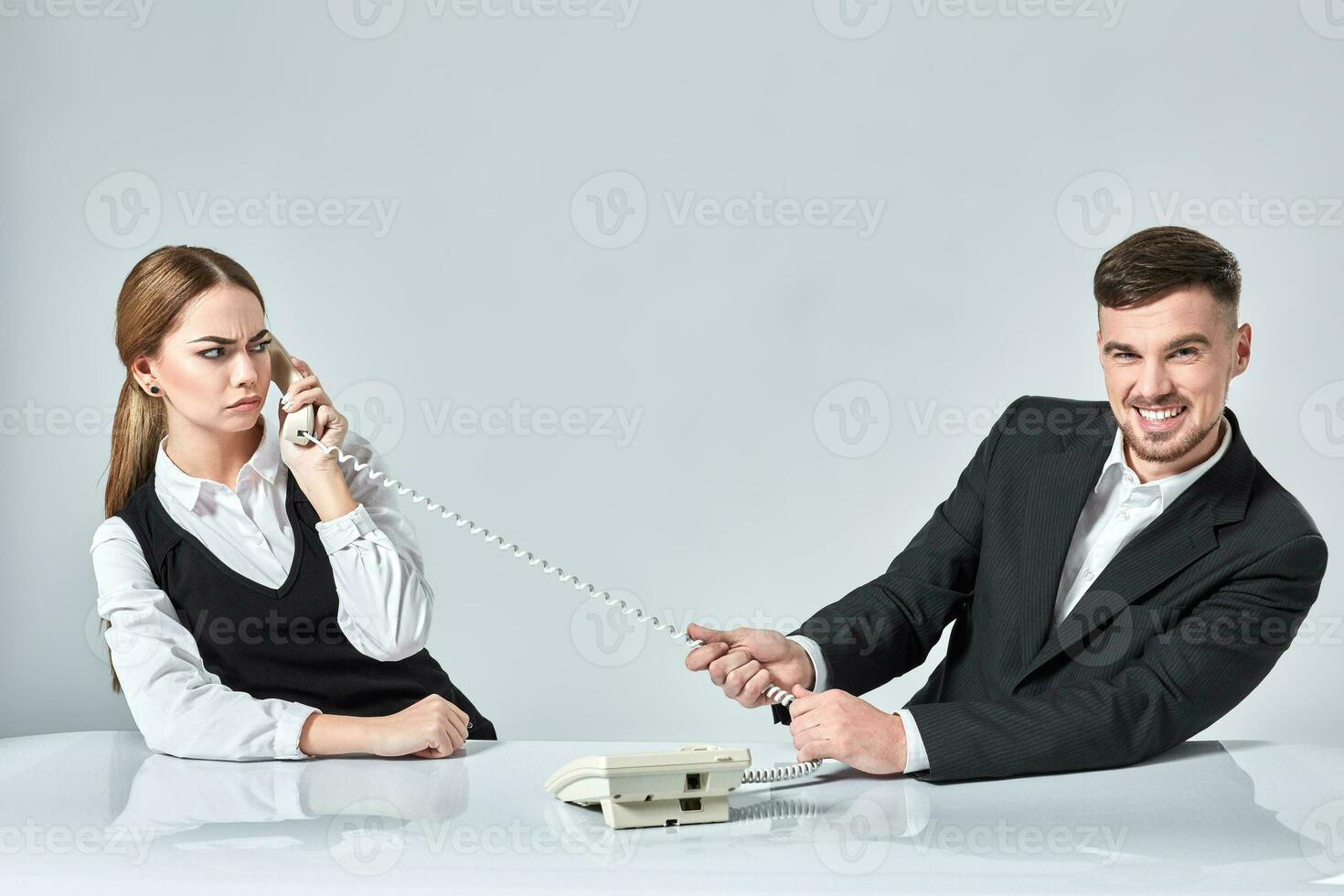 picture of man and woman with telephone at the table photo