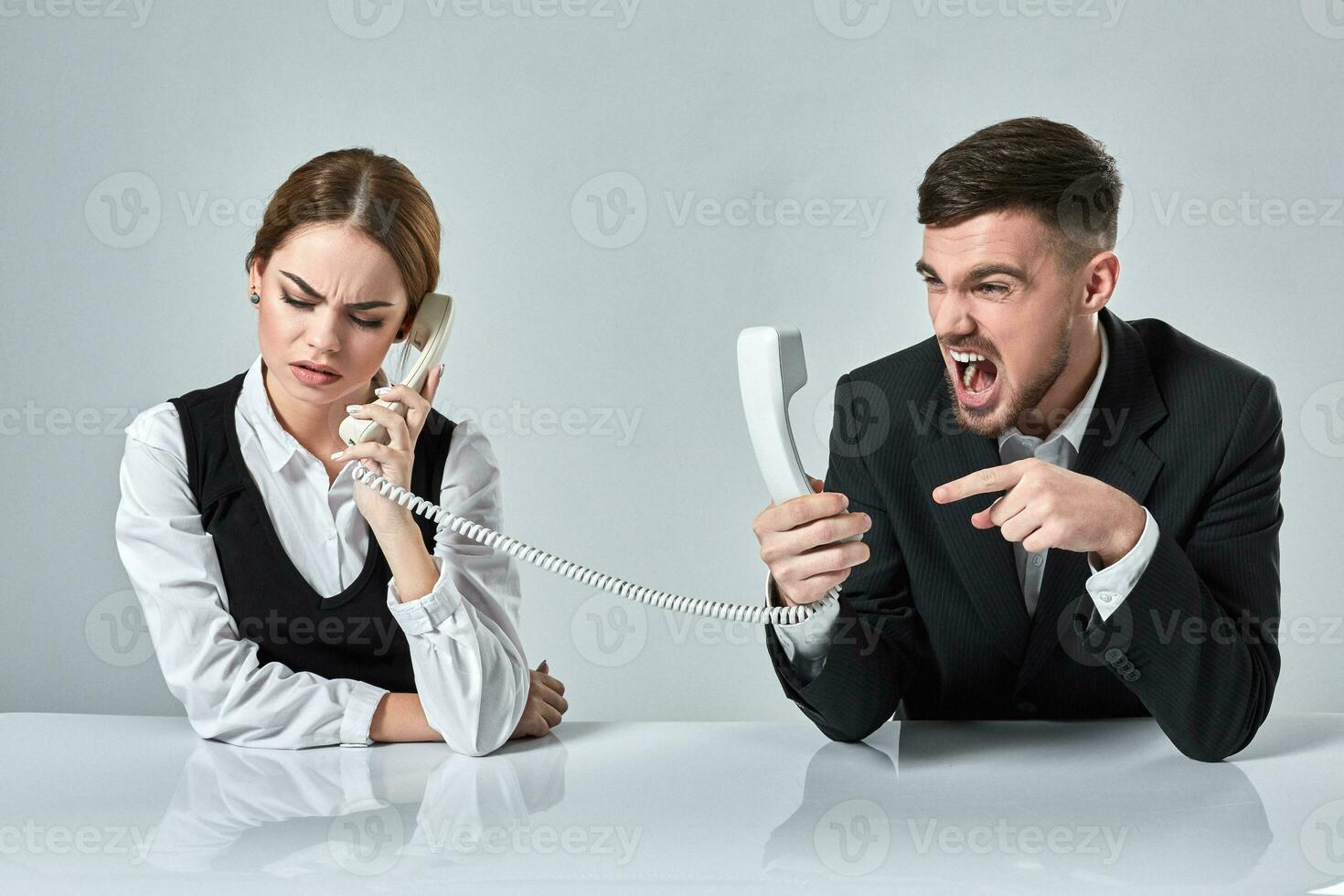 picture of man and woman with telephone at the table photo