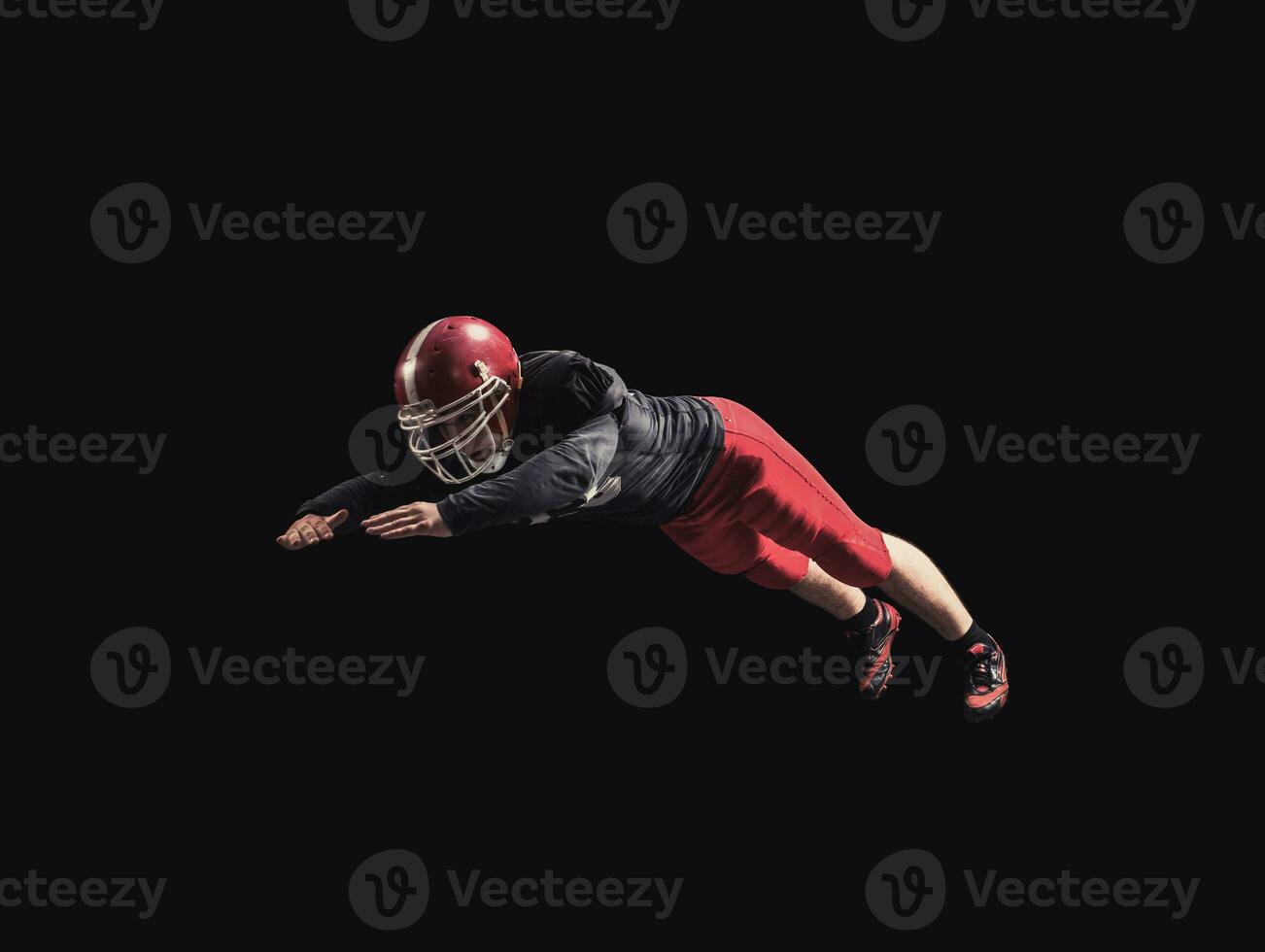 Football player on dark background photo