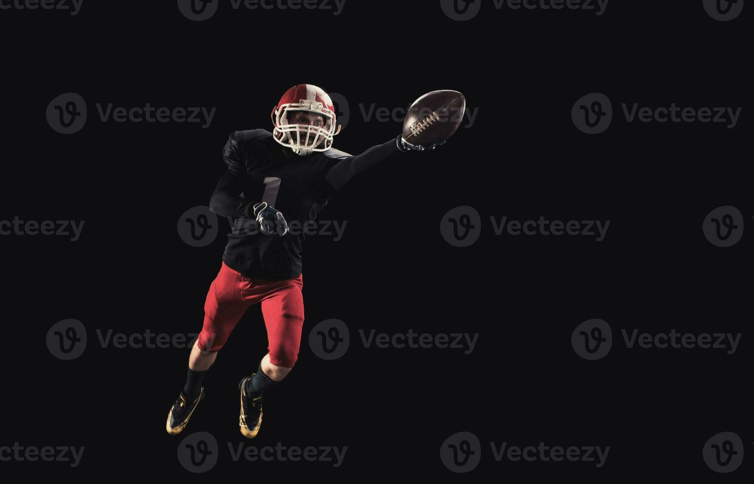 Football player on dark background photo