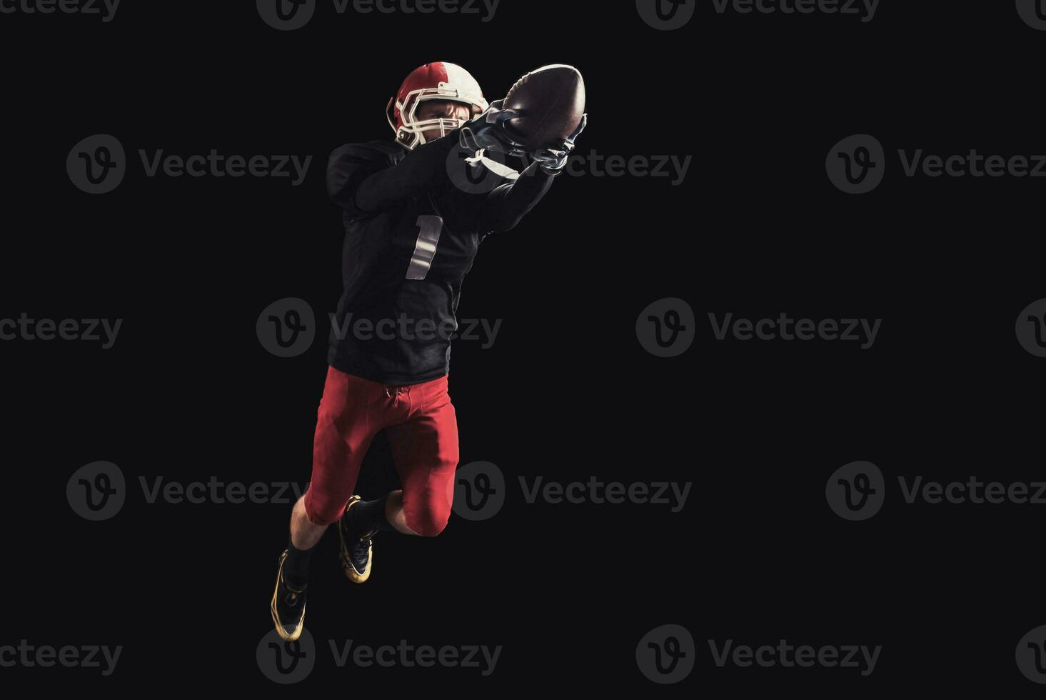 Football player on dark background photo