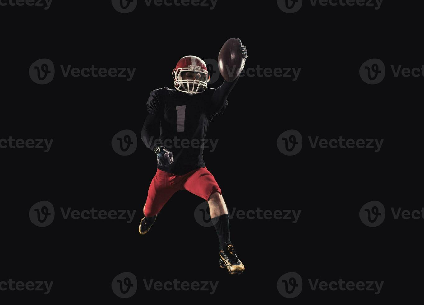 Football player on dark background photo