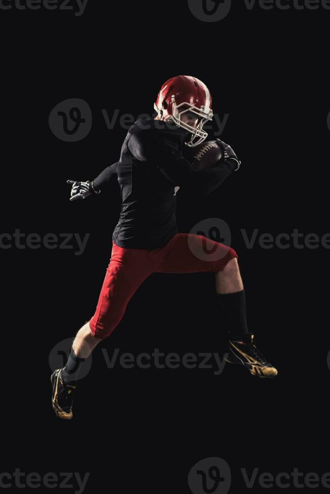 Football player on dark background photo