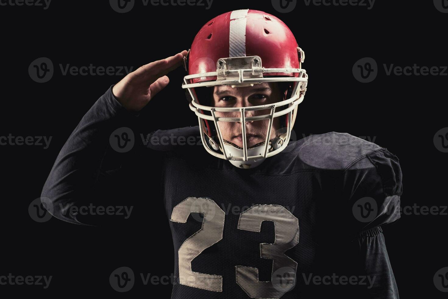 Football player on dark background photo