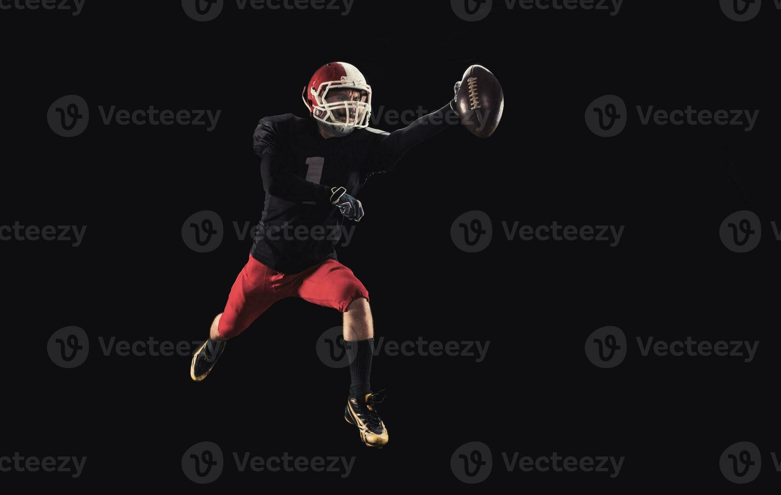 Football player on dark background photo