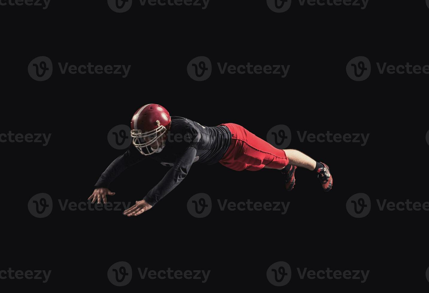 Football player on dark background photo