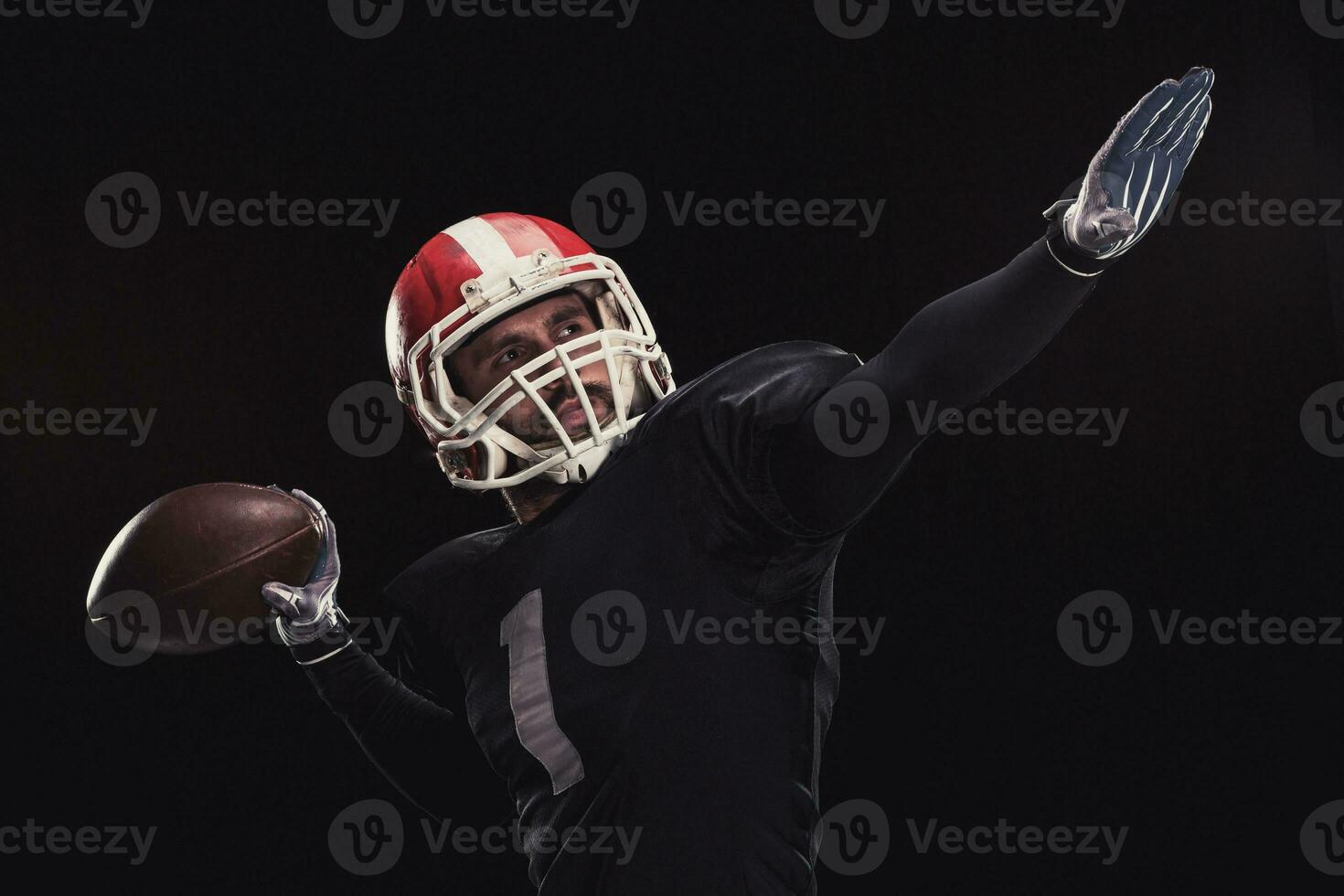 Football player on dark background photo