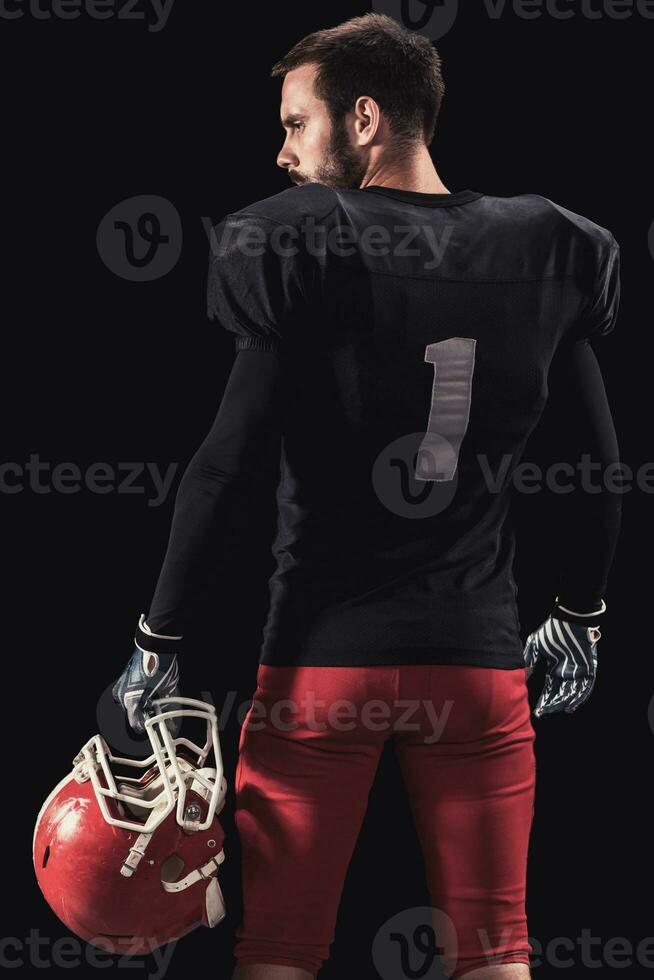 Football player on dark background photo