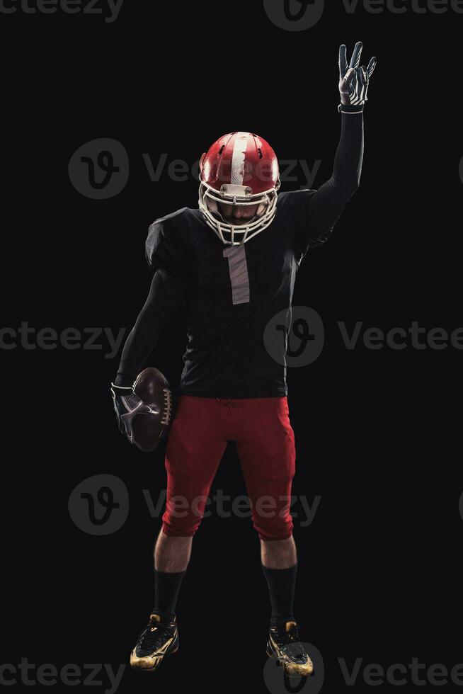 Football player on dark background photo