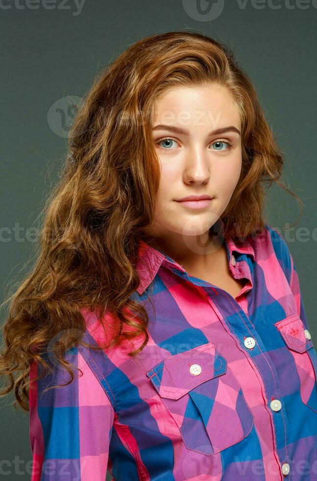 Portrait beautiful young brunette woman with wavy hair photo