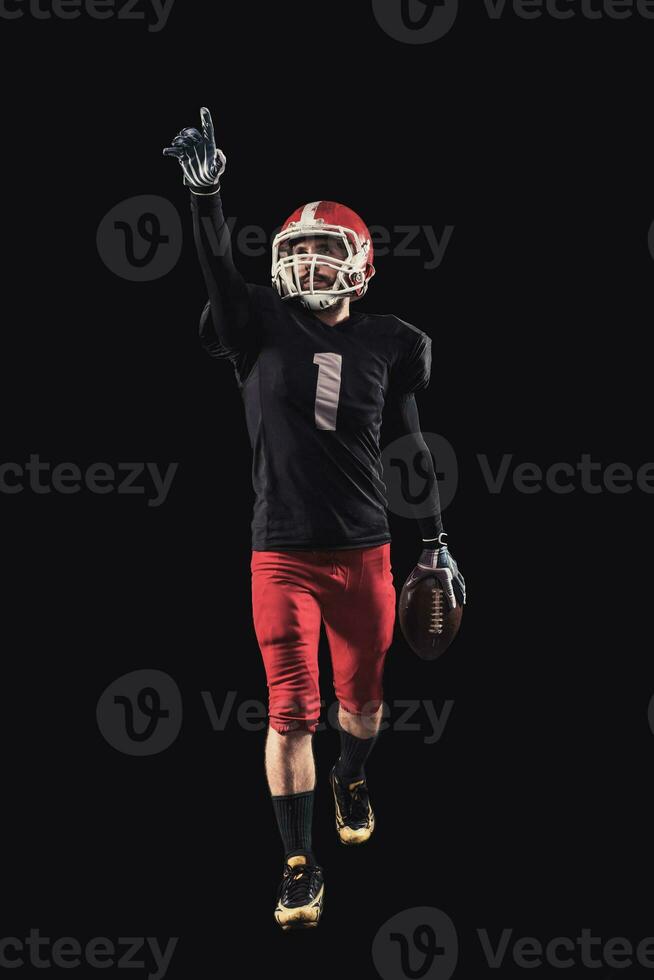 Football player on dark background photo