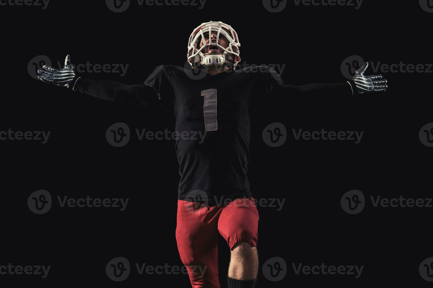 Football player on dark background photo