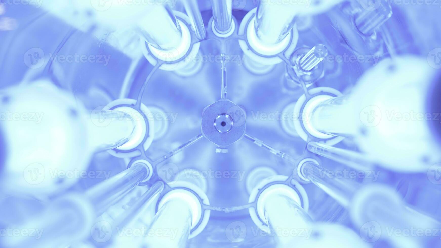 View inside of new modern water purification mechanism with LED lamps. Media. Concept of modern technologies for everyday life, close up of glowing blue lamps for water disinfection. photo