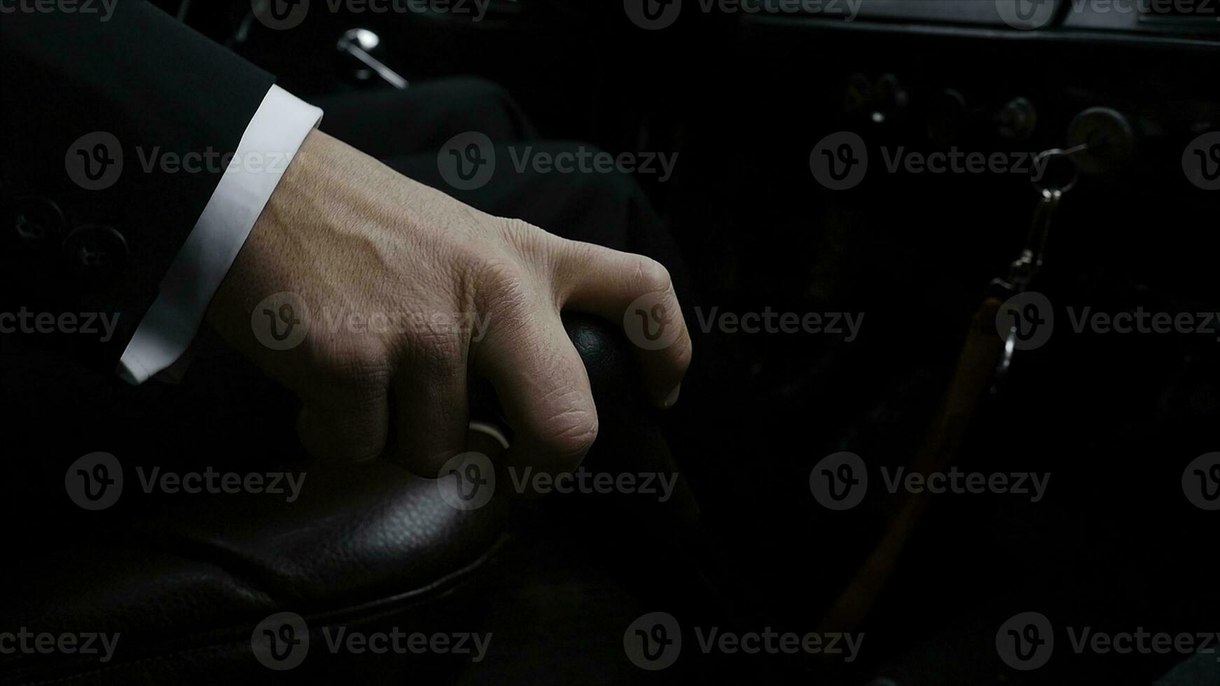 Businessman driving to work, hand shifting the gear stick. Businessman shifts the transmission in the rare machine. Businessman driving car hand shifting the gear stick. Retro style photo